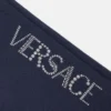 Dětské tepláky s rozšiřujícími se nohavicemi a třpytivým logem Versace Dětské tepláky s rozšiřujícími se nohavicemi a třpytivým logem Versace